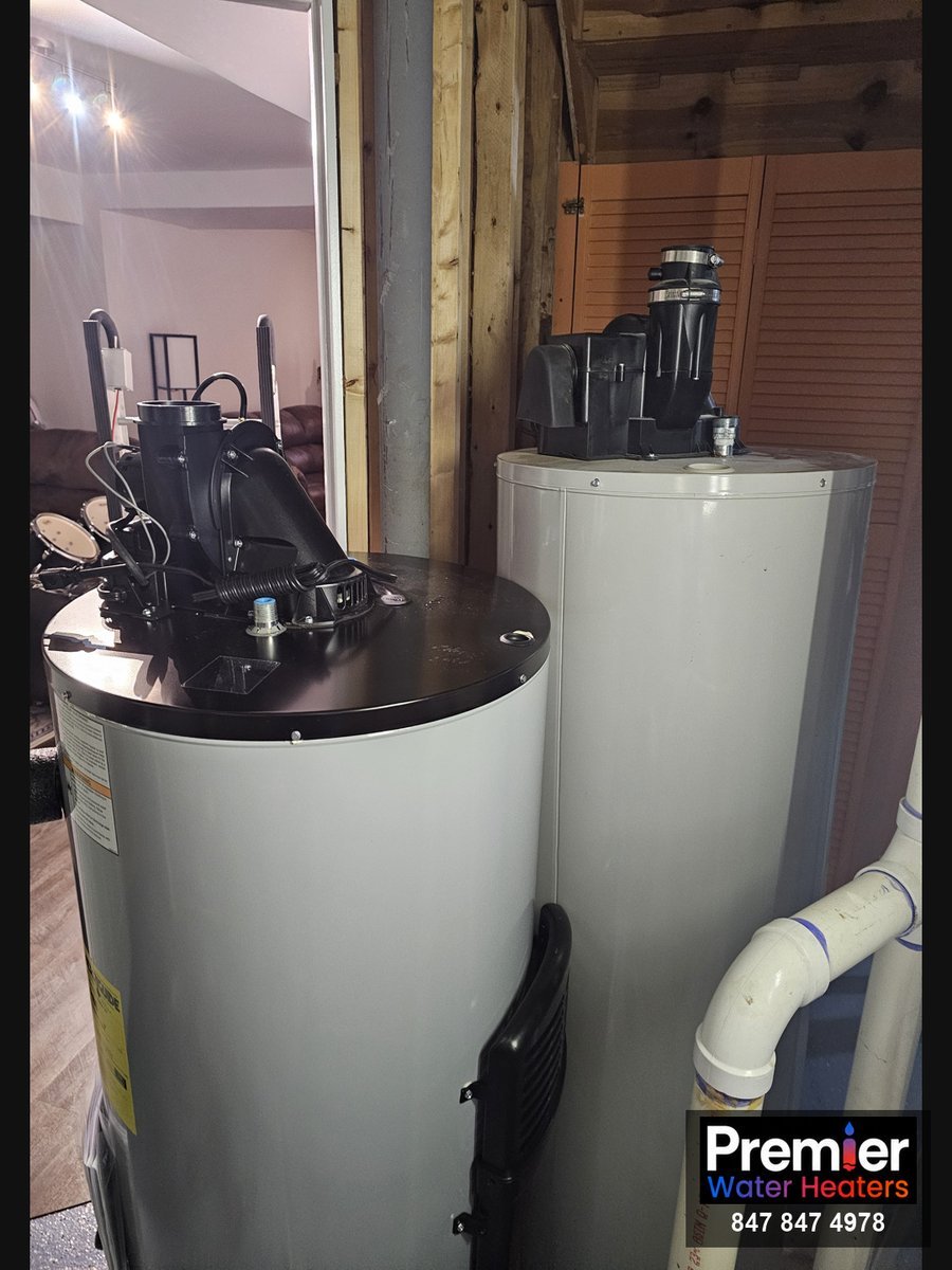 Old Bradford White and new AO Smith power vent water heaters side by side Algonquin IL
