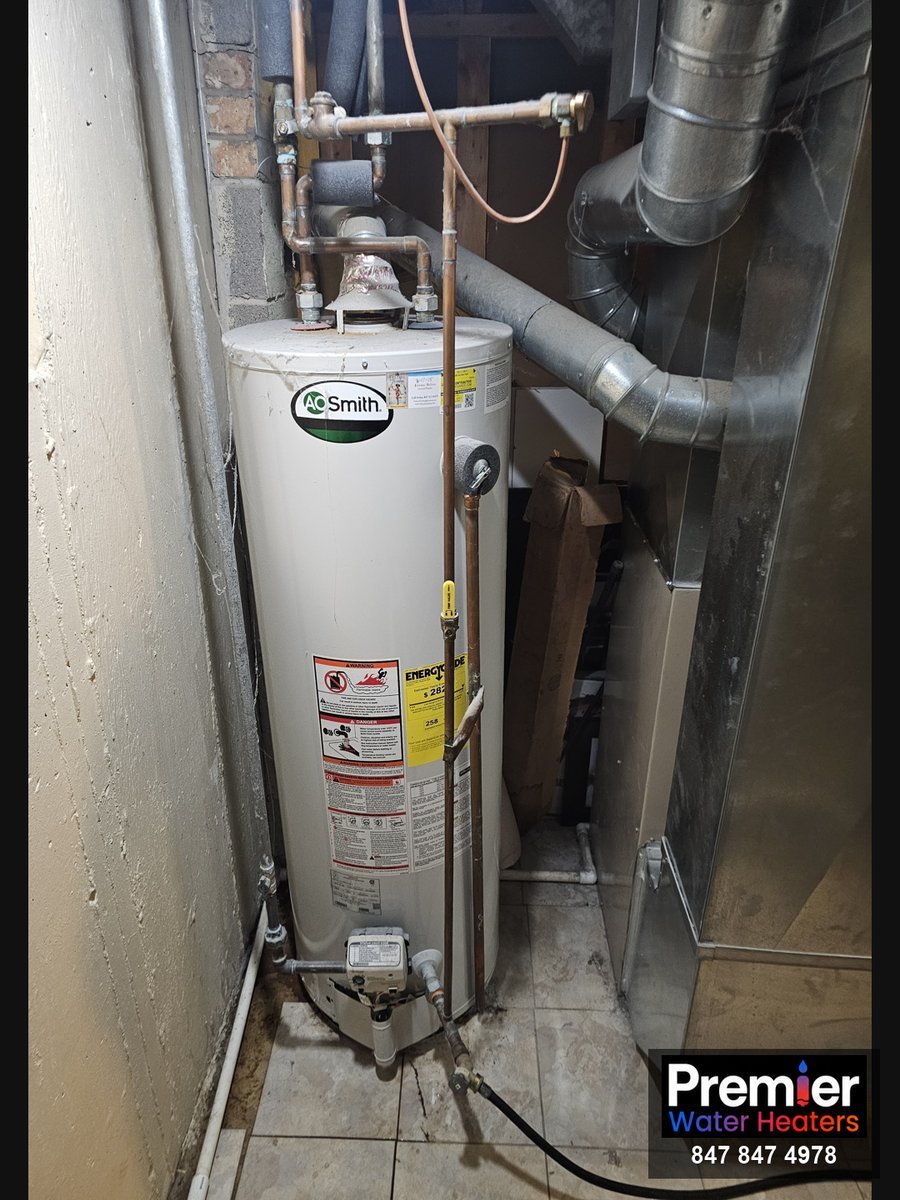 AO Smith 50-gallon water heater before replacement in tight utility closet Arlington Heights IL Premier Water Heaters