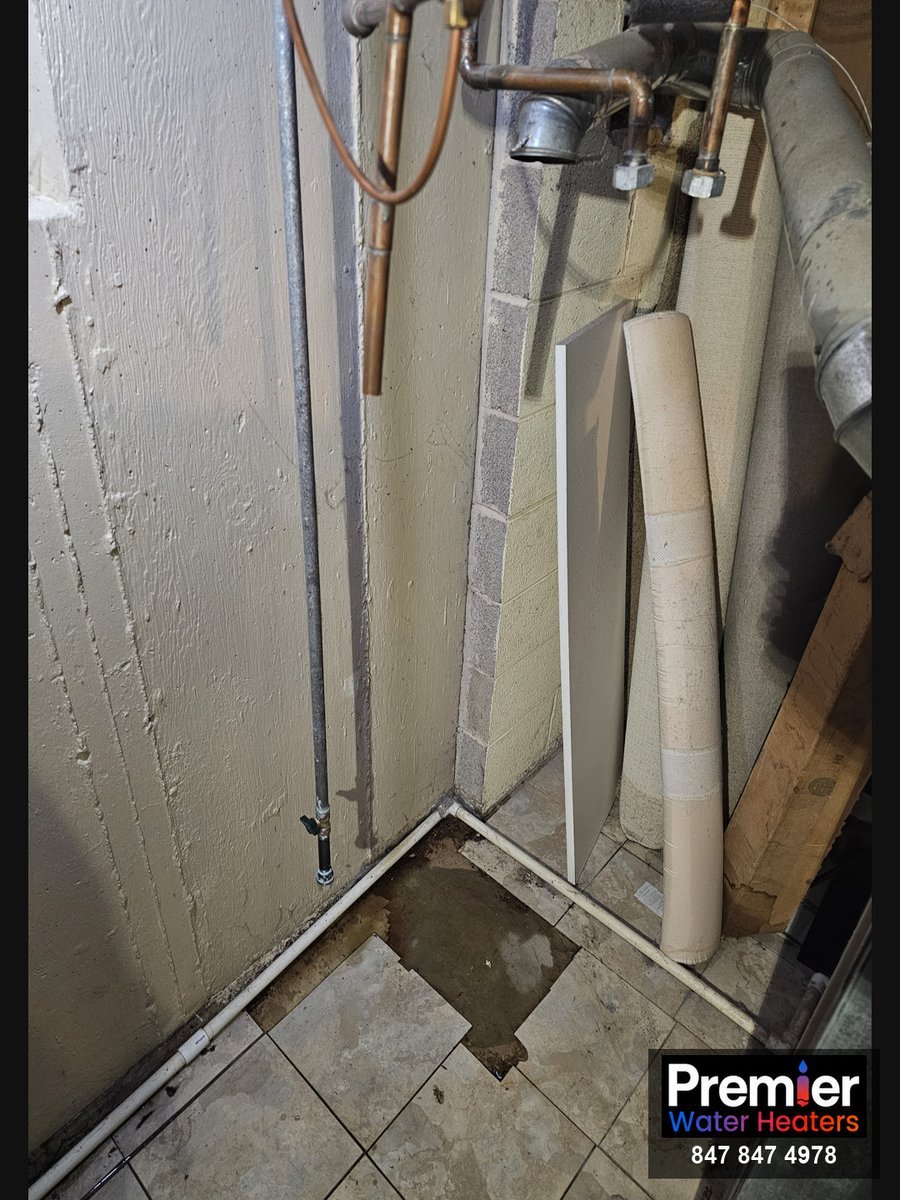 Utility closet cleared after old water heater removal Arlington Heights IL