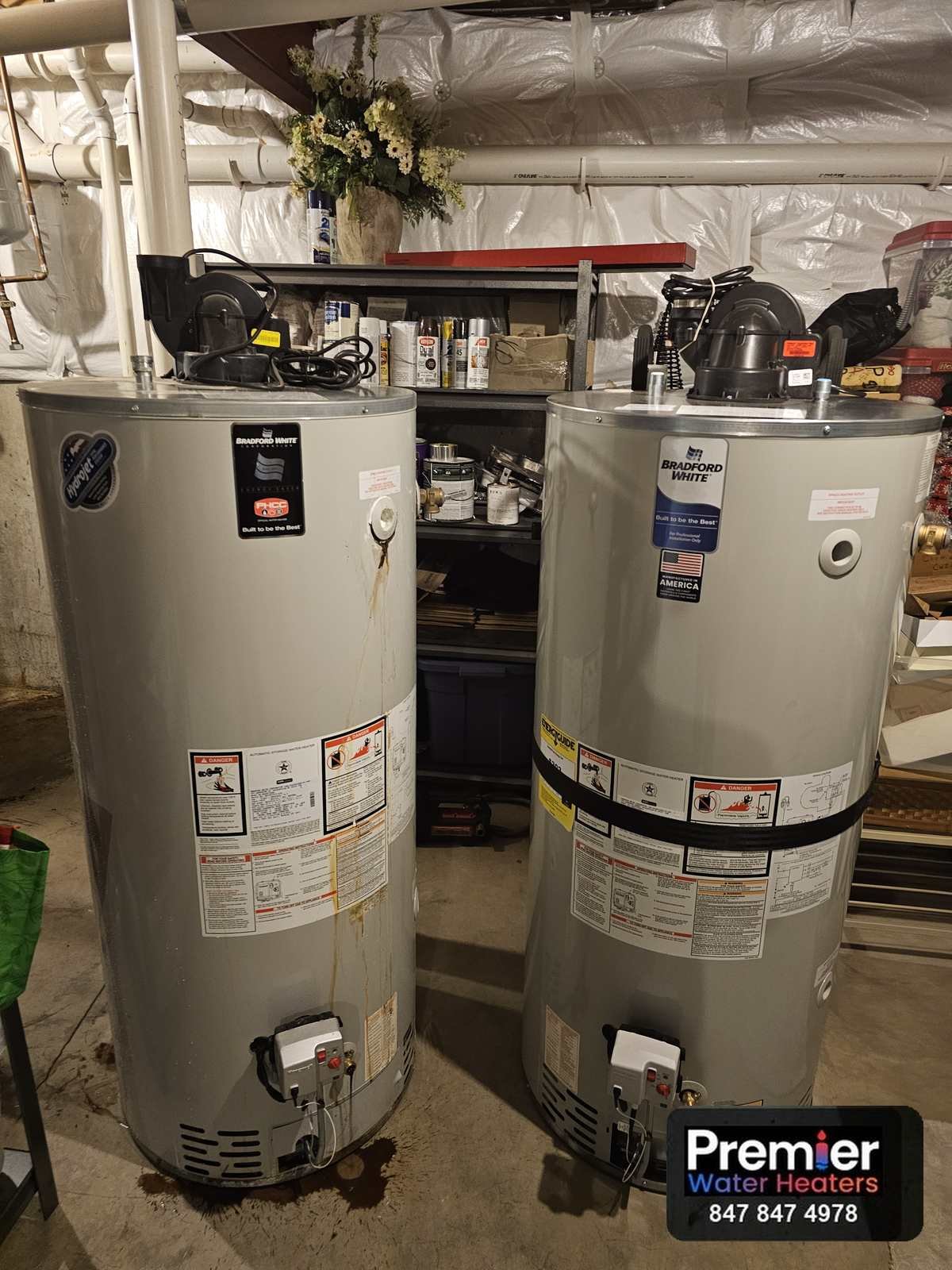 Old and new Bradford White 75 gallon power vent water heaters side by side Barrington IL