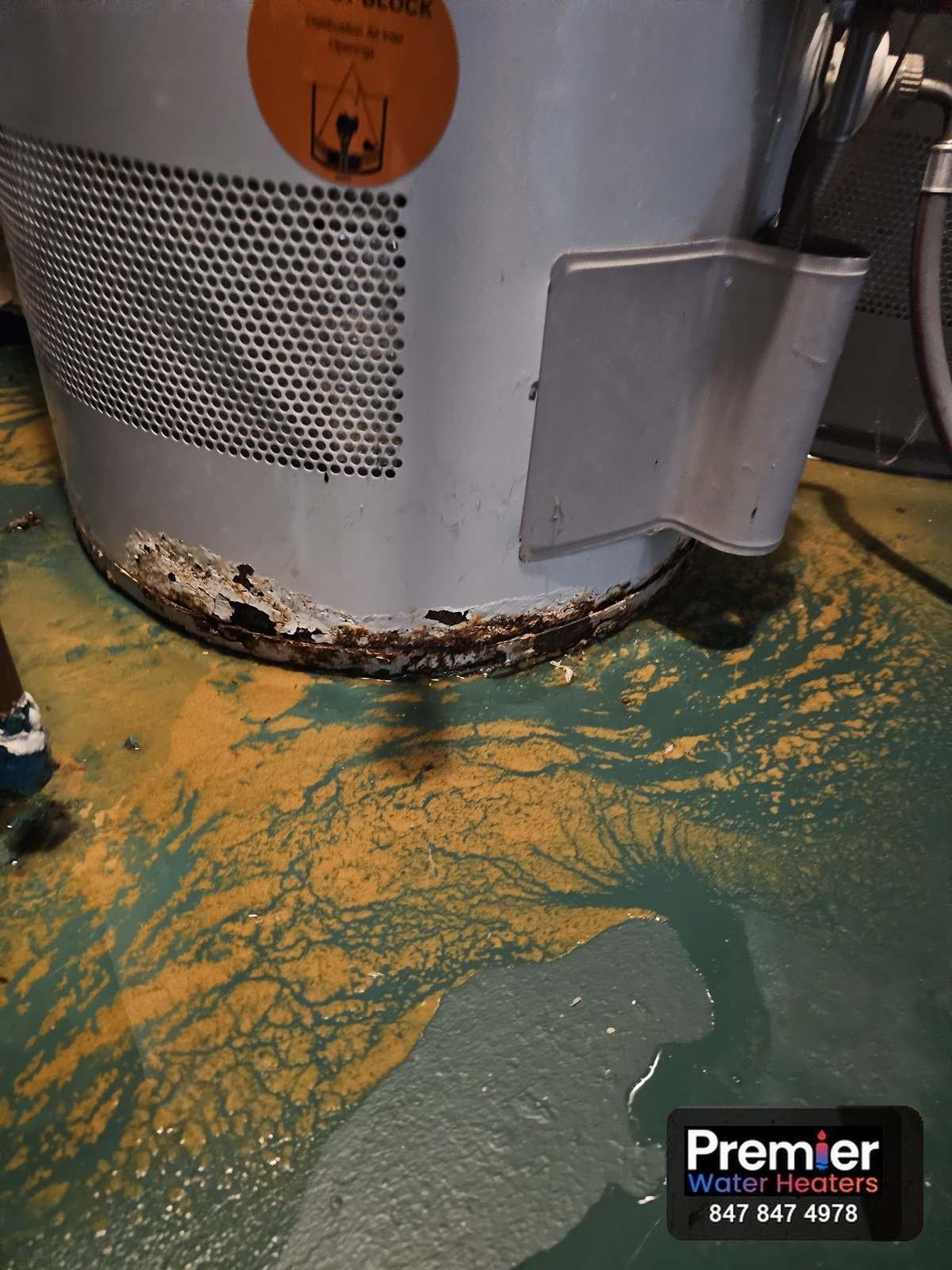 Rusted water heater base with water leaking on floor Barrington IL